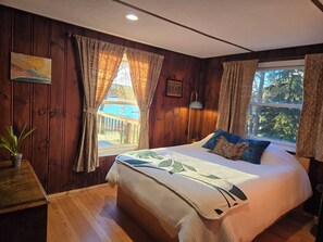 Primary bedroom (Queen bed) with private mini half bath.