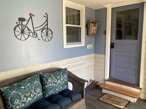 Arrive through the cozy sun porch 