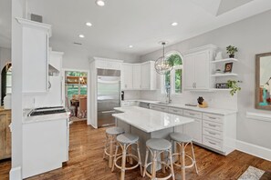 Fully stocked kitchen with seating for 4.