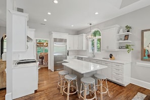 Fully stocked kitchen with seating for 4.
