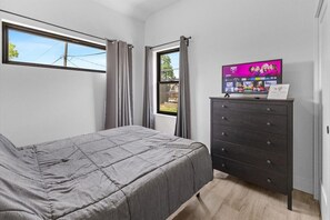 Queen bed with TV