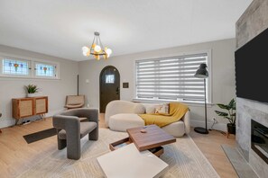 Stunning mix of textures and a pop of color make this living room special.