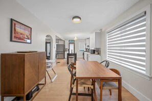 Clean lines, cozy vibes, and a dining table that screams elegance.