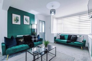 The spacious open-plan living space benefits from 2 sofa beds, a 40-inch smart TV and plenty of space to sit down and relax.