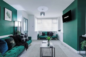 The spacious open-plan living space benefits from 2 sofa beds, a 40-inch smart TV and plenty of space to sit down and relax.