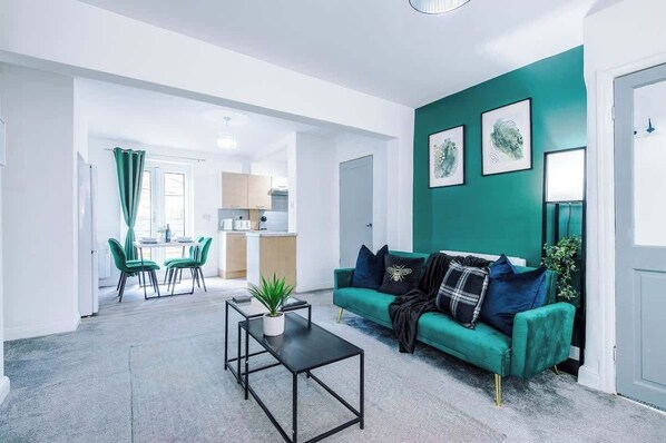 The spacious open-plan living space benefits from 2 sofa beds, a 40-inch smart TV and plenty of space to sit down and relax.