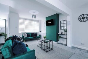 The spacious open-plan living space benefits from 2 sofa beds, a 40-inch smart TV and plenty of space to sit down and relax.