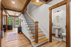 Beautiful Entrance with Powder Room and stairs leading to loft. 