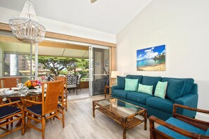 Unwind in a living room where contemporary charm meets tropical spirit, just steps from the lanai and golden sun     MKV-B247