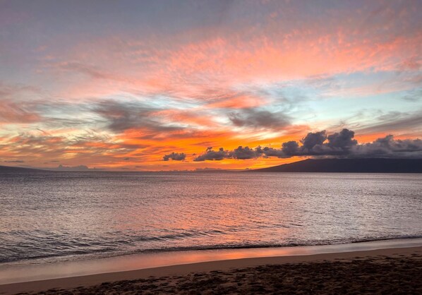 As day fades, the sky ignites?this breathtaking Maui sunset wraps the shoreline in a painter?s dream    MKV-B247