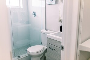 Step into tranquility in our thoughtfully designed bathroom—a haven of relaxation adorned with modern elegance. Immerse yourself in the serene ambiance and pamper in style.