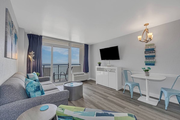 Special deals! This living space features a bright minimalist interior and a large sliding door that allows natural light to get in.