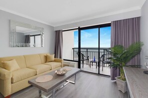 The living room offers versatile sleeping options with a convertible sofa bed, a Murphy bed, and an additional floor mattress for your convenience.