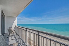 The charming oceanfront balcony, accessible from both the living room and master bedroom, is a delightful place to relish a cup of coffee while taking in the calming sounds of the waves.