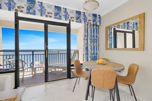 Abundant natural light floods the dining space, creating a bright and airy setting for dining.