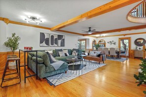 Unwind in a spacious living room with a 12 ft sectional sofa, a cozy reading nook, and the warm glow of a fireplace. Your perfect retreat awaits. 🛋️📖🔥 #LivingRoomEscape"