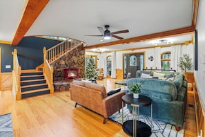 Unwind in a spacious living room with a 12 ft sectional sofa, a cozy reading nook, and the warm glow of a fireplace. Your perfect retreat awaits. 🛋️📖🔥 #LivingRoomEscape"