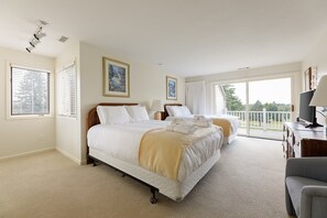 Bedroom #1 complete with two double beds and a lot of closet space. Walk right out the sliding glass doors right onto the private balcony