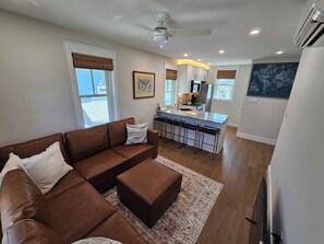 Living with a sectional couch that converts to a full-size bed.