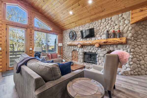 Living Room: Couch w/pull-out bed, loveseat, chair, HDTV, fireplace