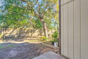 Enjoy the tranquility of our spacious backyard, perfect for family gatherings and outdoor fun.