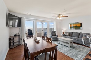 Open-concept living area with a queen sleeper sofa