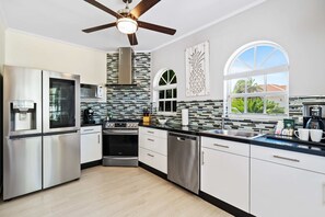 Cook up a storm in a fully equipped kitchen, perfect for gourmet meals and family feasts - Discover the joy of home-cooked meals in a kitchen with stainless steel appliances - Featuring sleek countertops and plenty of storage