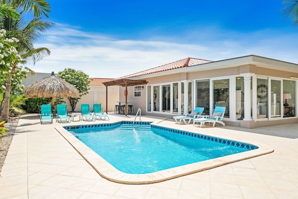 Dive into luxury with your own private pool, perfect for unwinding after a day of adventure - Experience ultimate relaxation in serene backyard oasis, featuring plenty of lounge chairs - Cool off and soak up the sun in exclusive private pool