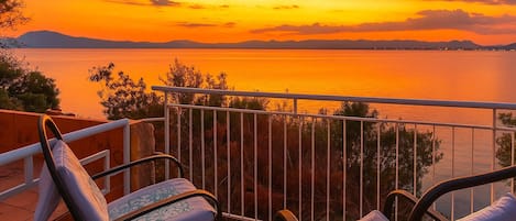 Seafront Terrace at Sunset • Wine, Waves & Golden Sky