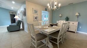 Dining table for 6 with bar trolley, and direct access to all parts of the house