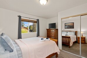 Drift off to dreams of trees and rivers in one of the home's  comfortable queen beds
