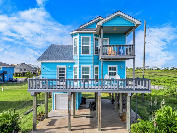 Vibrant blue exterior with spacious decks for sunbathing and scenic views!