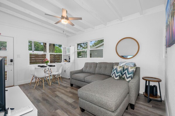 The ambiance of the living room is further enhanced by carefully planned lighting.
