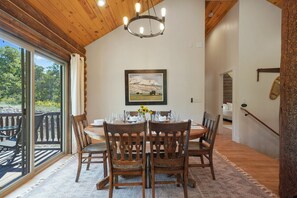 Dining with a view: Enjoy meals at this cozy 6-seat table overlooking the deck and nature’s beauty