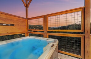 Hot tub: Soak in luxury while soaking up stunning mountain views at sunset!