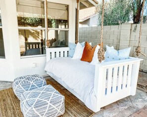 Beautiful, comfy twin bed swing is available for relaxing, overlooking the pool.