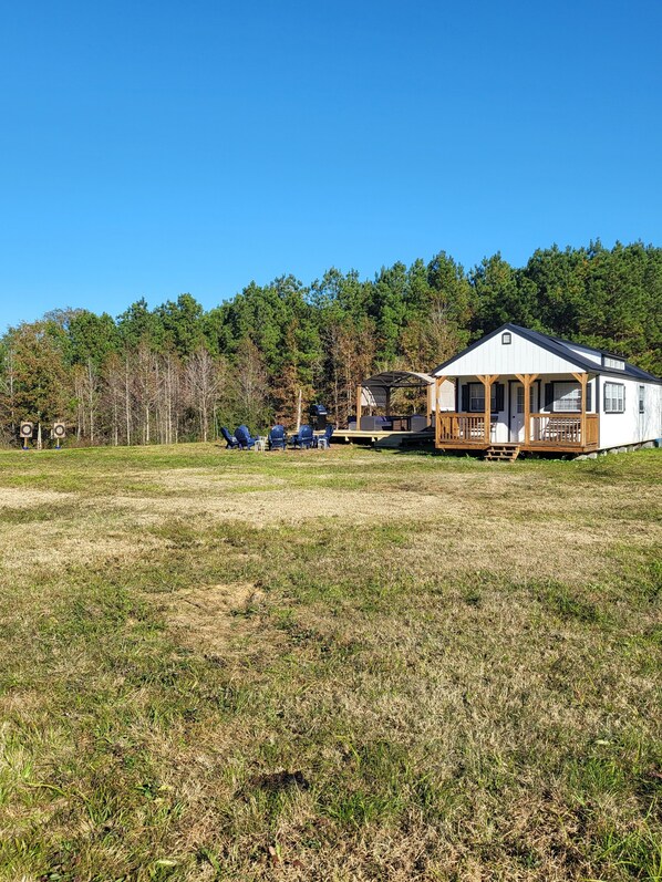 Fire pit, grill, and deck with large seating provided
