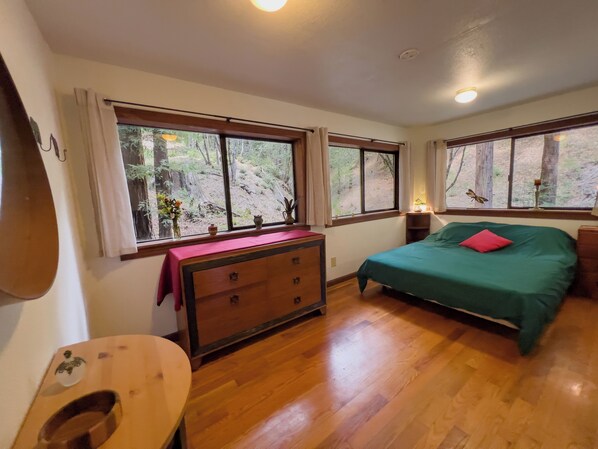 You will love the bedroom with views of the surrounding Redwood trees.