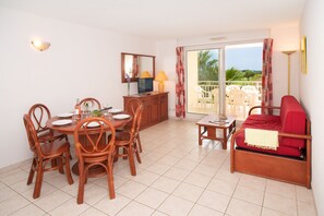 Relax on the sofa after a day in the sun. Views from the balcony/patio vary.