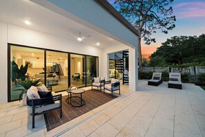 Comfy outdoor seating right by the pool - Brew a hot cup of coffee and start your morning off right in this perfectly tranquil spot!
