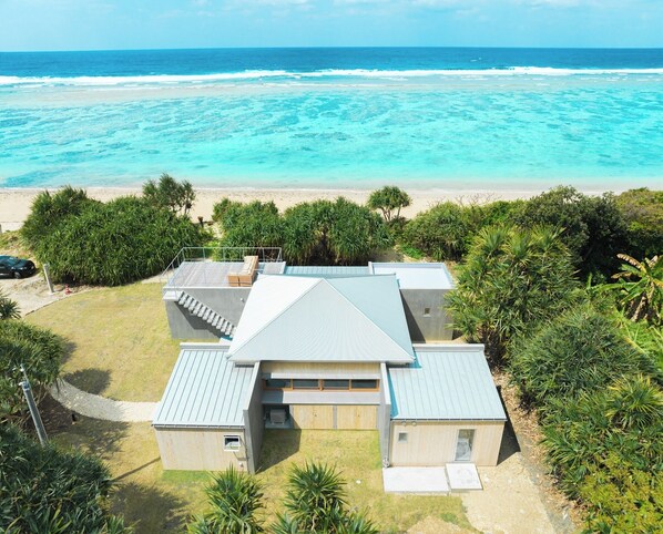 The exterior of Sani's house. The Madagascar pandanus that surround the house ensures privacy.