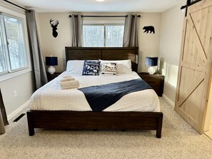 A wonderful king sized bed with an attached private bathroom and a TV