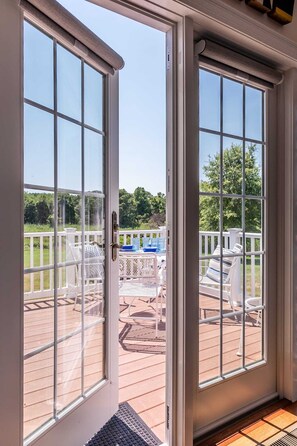 French doors to deck overlooking water