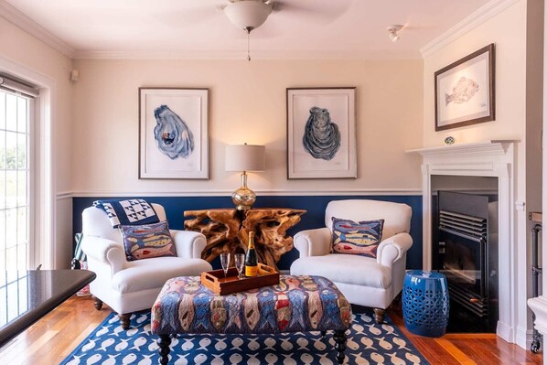 Den with french doors waterfront deck.