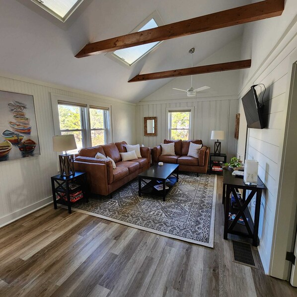 Gather & unwind in our cozy living room with plush seating & natural light.