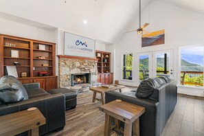 Living Area w/ Smart TV, Gas Fireplace, and Deck Access
