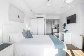 The wall-mounted TV is viewable straight from the pillow for cosy nights at home.
