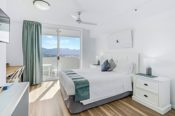 Sleep easy in the queen-sized bed. It comes set with crisp white linens, side tables and reading lights with direct access to the balcony. 
