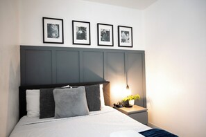 The secondary bedroom features a queen bed.