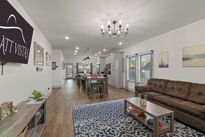 Open Concept Living Room with 65" 4K Flat Screen & Board Games (1)